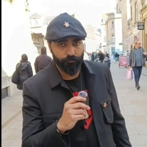 Comrade Ali speaks at an anti-war rally in Bath