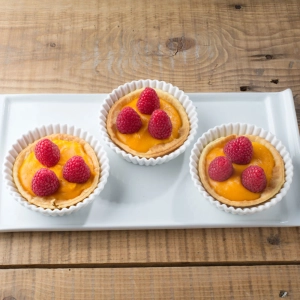 Tartaleta de calabaza y queso Grana Padano, miel y frambuesas